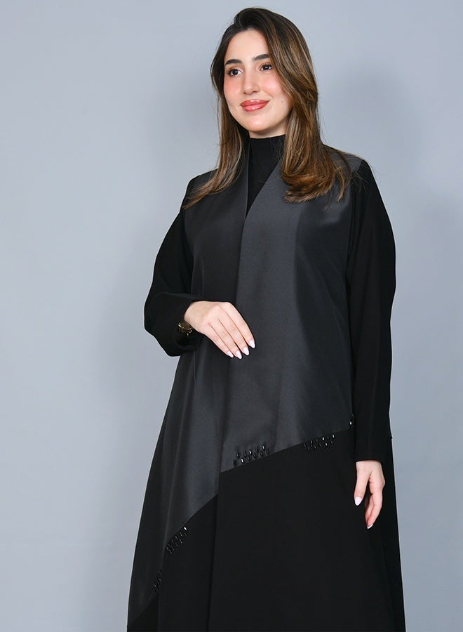 HAWRAA ABAYA Elegant black abaya embellished with delicate beadwork, featuring a refined cloche silhouette - Image 1